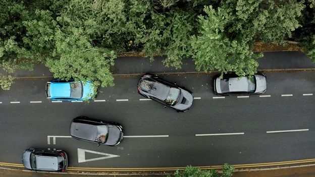 Aerial footage of a row of cars for Turo